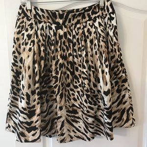 On trend for Fall 2024 style, White House Black Market animal print skirt